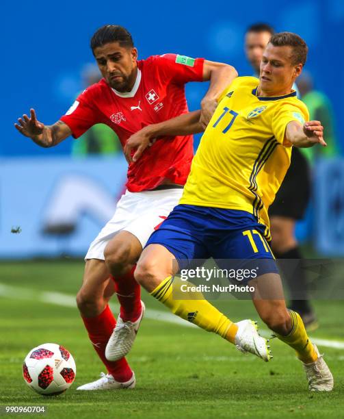 John Guidetti of the Sweden national football team and Ricardo Rodriguez of the Switzerland national football team vie for the ball during the 2018...