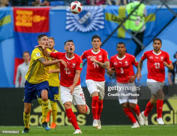 Blerim Dzemaili of the Switzerland national football team vie for the ball during the 2018 FIFA World Cup match, Round of 16 between Sweden and...