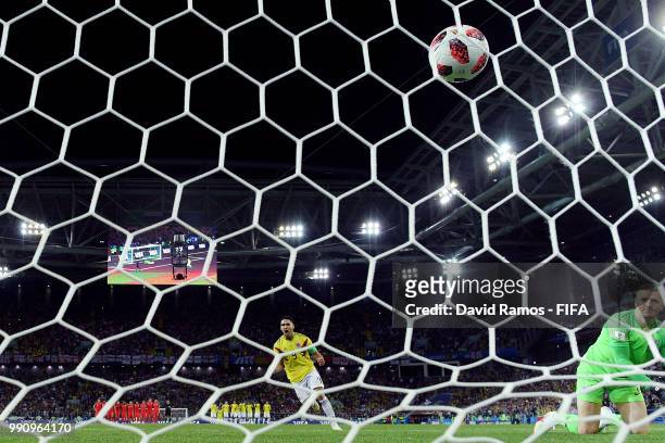 Radamel Falcao of Colombia scores his team's first penalty pats Jordan Pickford of England in the penalty shoot out during the 2018 FIFA World Cup...