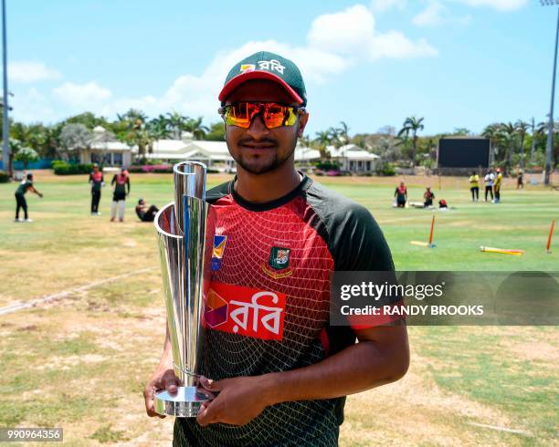 Shakib Al Hasan of Bangladesh with the ICC Women's World T20 trophy while taking part in a training session one day ahead of the 1st Test between...