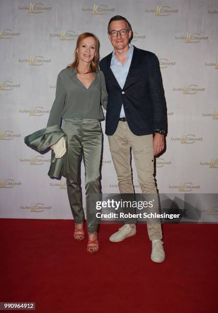 Katja Flint and Juergen Leuthe attend the 20 years event of Luisa Cerano at St Agnes Church on July 3, 2018 in Berlin, Germany.