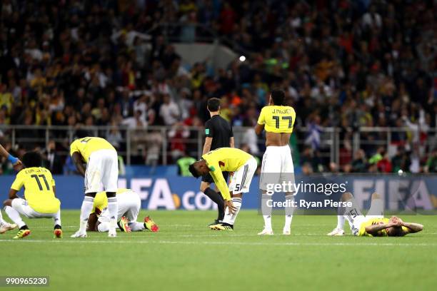 Colombia players look dejected following their sides defeat in a penalty shoot out during the 2018 FIFA World Cup Russia Round of 16 match between...