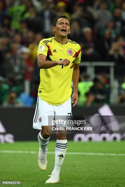 Colombia's forward Carlos Bacca reacts after missing to score a penalty kick during the penalty shoot-out of the Russia 2018 World Cup round of 16...