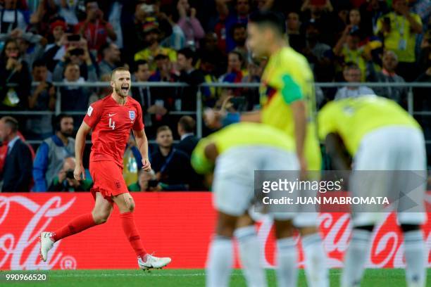 England's midfielder Eric Dier celebrates scoring during the penalty shootout during the Russia 2018 World Cup round of 16 football match between...