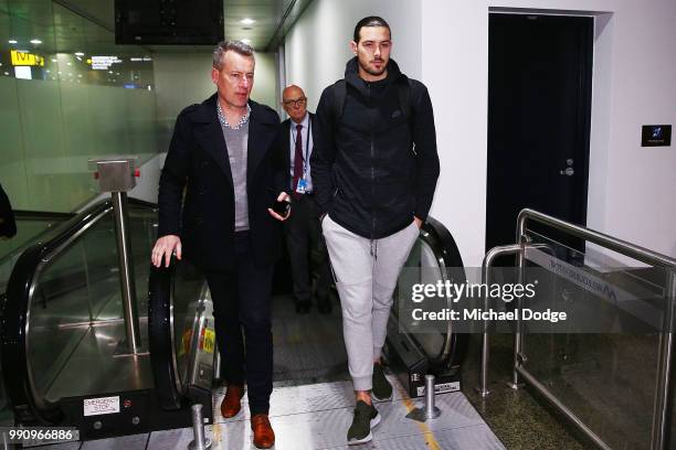 Boomers basketballer Chris Goulding leaves with NBL Communications manager Nick Johnson Melbourne Airport on July 4, 2018 in Melbourne, Australia....