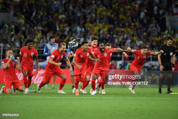 England's players celebrate winning the penalty shootout at the end of the Russia 2018 World Cup round of 16 football match between Colombia and...