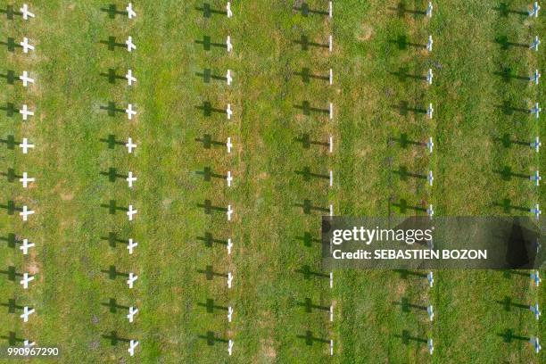 An aerial picture shows the cemetery of Vieil Armand, formerly called Hartmannswillerkopf, in the Vosges mountains of eastern France, on July 3,...