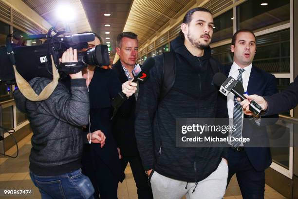 Boomers basketballer Chris Goulding leaves with NBL Communications manager Nick Johnson Melbourne Airport on July 4, 2018 in Melbourne, Australia....