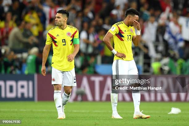 Radamel Falcao and Johan Mojica of Colombia show their dejection following the 2018 FIFA World Cup Russia Round of 16 match between Colombia and...