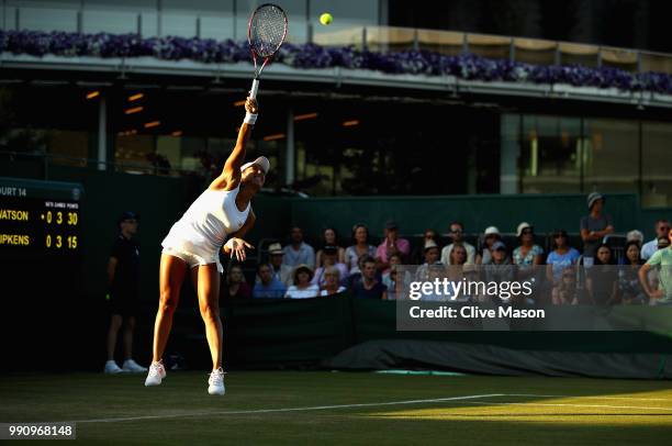 Heather Watson of Great Britain in action against Kirsten Flipkens of Belgium during their Ladies' Singles first round match at the All England Lawn...