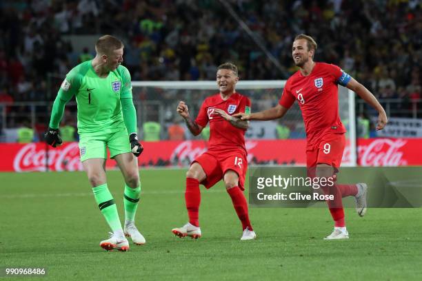 Jordan Pickford of England is mobbed by teammates Kieran Trippier and Harry Kane in celebration after penalty shootout following the 2018 FIFA World...