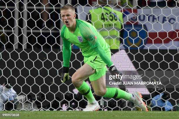 England's goalkeeper Jordan Pickford celebrates stopping Colombia's forward Carlos Bacca's shot during the penalty shootout at the end of the Russia...