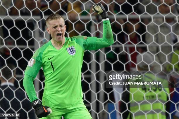 England's goalkeeper Jordan Pickford celebrates stopping Colombia's forward Carlos Bacca's shot during the penalty shootout at the end of the Russia...