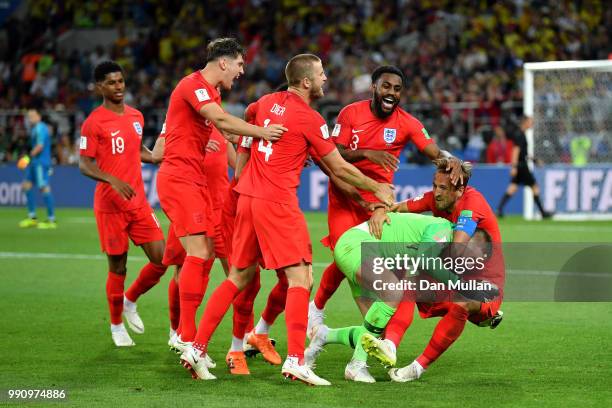 Jordan Pickford of England is mobbed by teammates in celebration after penalty shootout following the 2018 FIFA World Cup Russia Round of 16 match...