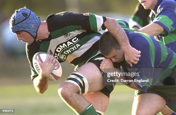 Adam Wallace-Harrison of Sunnybank is tackled by Cameron Adams of GPS during the XXXX Brisbane club Rugby Union premiership match between Sunnybank...