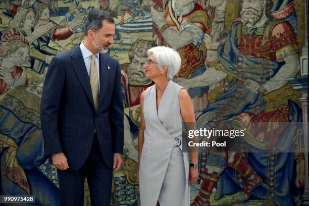 The new State Attorney General, Maria Jose Segarra, talks with King Felipe VI during a swearing in ceremony at the Palacio de la Zarzuela on July 3,...