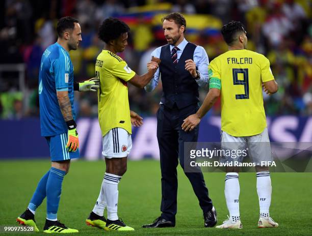 Gareth Southgate consoles Colombia players following Colombia's defeat in the 2018 FIFA World Cup Russia Round of 16 match between Colombia and...