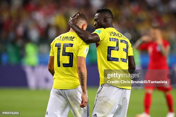 Davinson Sanchez of Colombia talks with teammate Mateus Uribe after the 2018 FIFA World Cup Russia Round of 16 match between Colombia and England at...