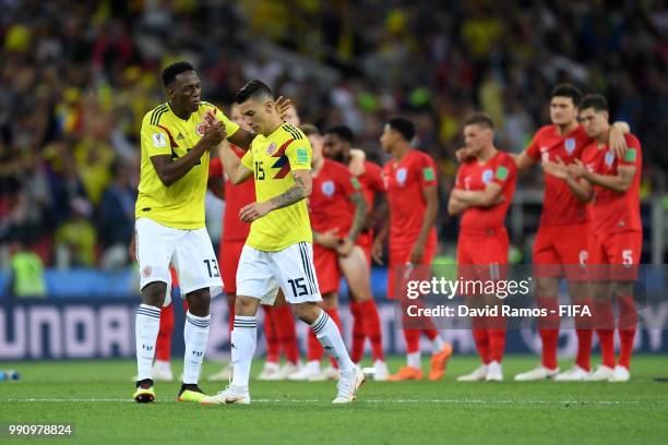 Yerry Mina of Colombia encourages Mateus Uribe of Colombia before his takes his penalty during the 2018 FIFA World Cup Russia Round of 16 match...