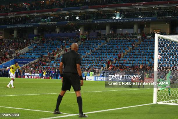 Jordan Pickford of England saves the penalty of Carlos Bacca of Colombia to secure victory in a penalty shootout at the end of extra time during the...