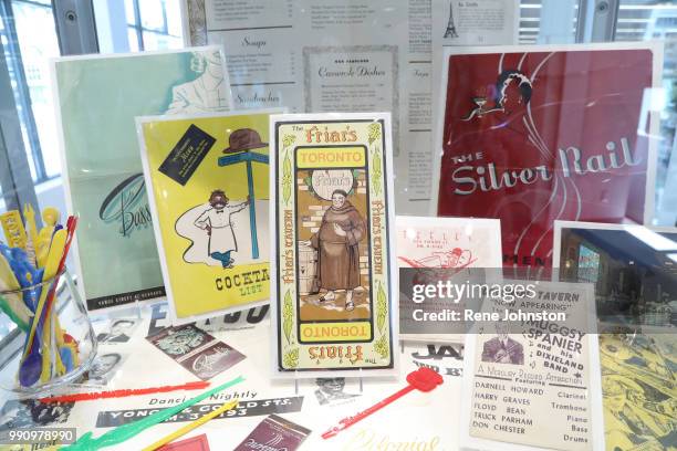 Detail of some of the menu's stir sticks and flyers from the great days of Yonge Street rock and roll. Co-curator Jan Haust and Roman Records owner...