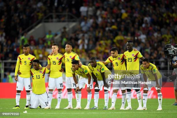 The Colombia players watch on as Eric Dier of England scores his sides winning penalty in the penalty shoot out during the 2018 FIFA World Cup Russia...