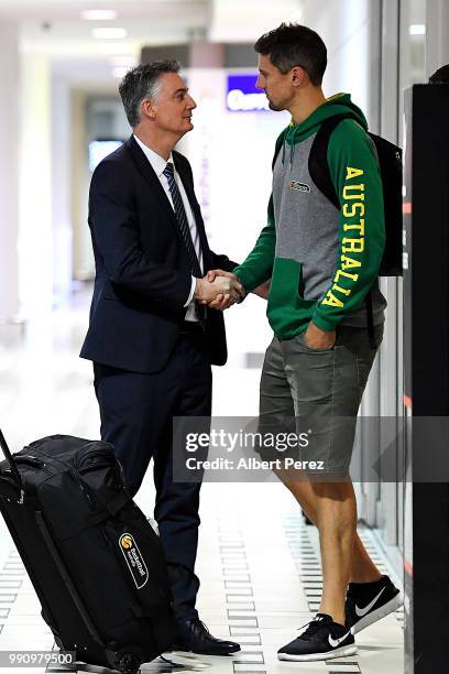 Basketball Australia CEO Anthony Moore shakes hands with Daniel Kickert as he arrives at Brisbane Airport on July 4, 2018 in Brisbane, Australia. The...