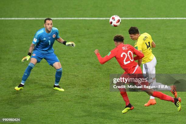 Dele Alli of England compete for the ball with Santiago Arias of Colombia during the 2018 FIFA World Cup Russia Round of 16 match between Colombia...