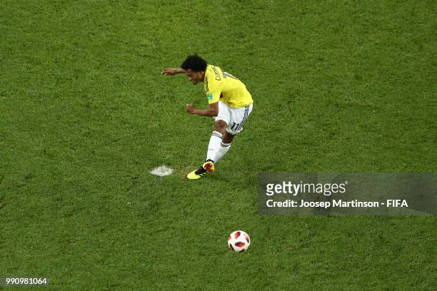 Juan Cuadrado of Colombia scores his sides second penalty during the 2018 FIFA World Cup Russia Round of 16 match between Colombia and England at...