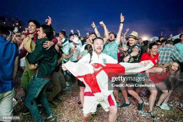 England fans celebrate as they win the penalty shoot out during the FIFA 2018 World Cup Finals match between Colombia and England at Brighton Lunar...