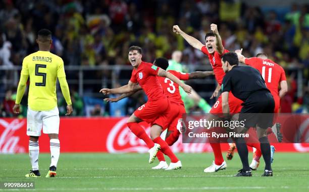 John Stones, ang3a and Harry Maguire of England celebrate victory during the 2018 FIFA World Cup Russia Round of 16 match between Colombia and...