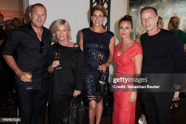 Heino Ferch, Elisabeth Schwaiger, Marie-Jeanette Ferch, a guest and Dirk Reicher are seen at the Laurel Collection Presentation during the Berlin...