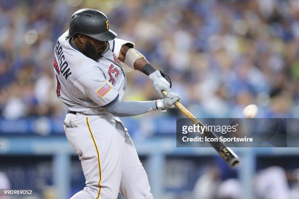 Pittsburgh Pirates second baseman Josh Harrison makes contact at the plate in the game between the Pittsburg Pirates and the Los Angeles Dodgers,...