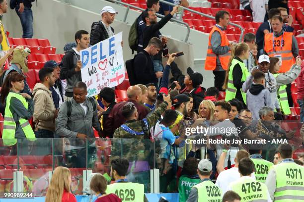 Dele Alli of England celebrates his team's victory in a penalty shootout with fans at the end of extra time during the 2018 FIFA World Cup Russia...