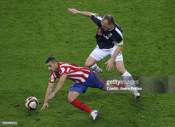 Danny Murphy of Fulham tackles Simao of Atletico Madrid during the UEFA Europa League final match between Atletico Madrid and Fulham at HSH Nordbank...