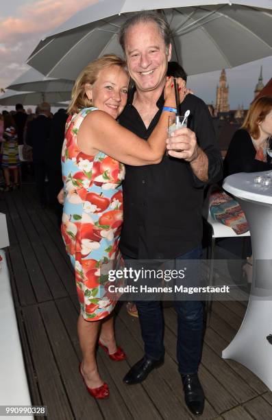 Actor Tom Gerhardt and Gabriele Walther during the summer party at Hotel Bayerischer Hof on July 3, 2018 in Munich, Germany.