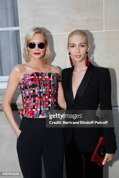 Sabine Getty and Poppy Delevingne attend the Giorgio Armani Prive Haute Couture Fall Winter 2018/2019 show as part of Paris Fashion Week on July 3,...