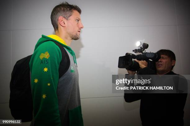 Australian basketball player Daniel Kickert arrives at Brisbane airport on July 4 two days after their FIBA World Cup Asian qualifying game against...