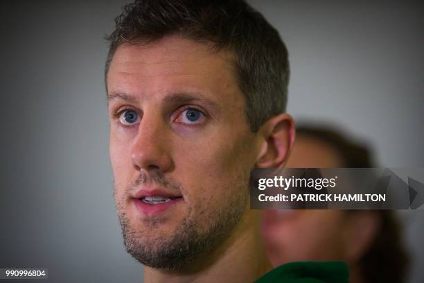 Australian basketball player Daniel Kickert speaks during a press conference at Brisbane airport on July 4 two days after their FIBA World Cup Asian...