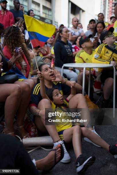 Colombian football fans living in London watch their team's eventual 4-3 loss with England in the knock-out stage of the World Cup at Elephant and...
