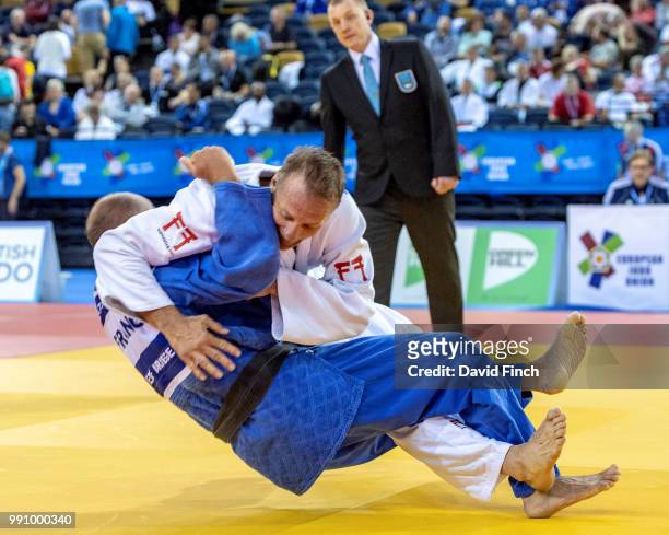Kenneth Larsson of Sweden throws Thierry Brunet of France for an ippon to win the u81kg M6 bronze medal during day 1 of the 2018 Glasgow Veteran...