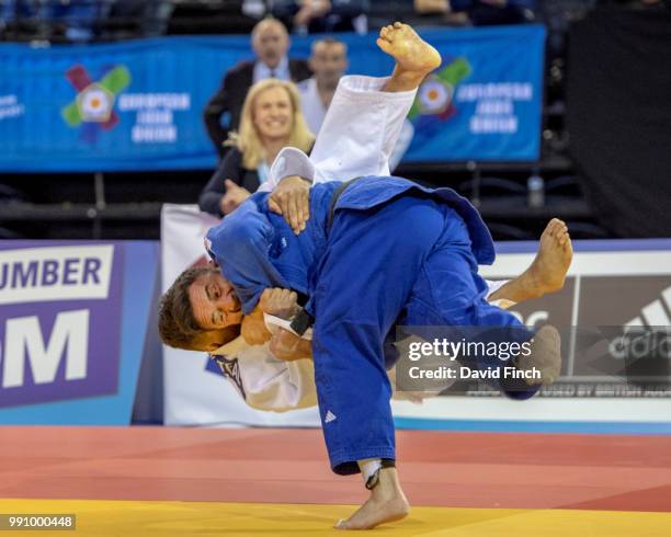 Jean Luc Garcia of France throws Mark Teal of Great Britain for an ippon to win the u66kg M5 semi-final on his way to the gold medal during day 1 of...