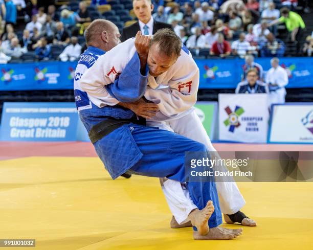 Kenneth Larsson of Sweden throws Thierry Brunet of France for an ippon to win the u81kg M6 bronze medal during day 1 of the 2018 Glasgow Veteran...