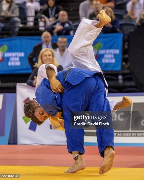 Jean Luc Garcia of France throws Mark Teal of Great Britain for an ippon to win the u66kg M5 semi-final on his way to the gold medal during day 1 of...