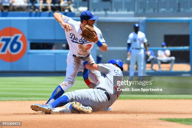Chicago Cubs outfielder Kyle Schwarber sides hard into Los Angeles Dodgers infielder Chris Taylor during a MLB game between the Chicago Cubs and the...