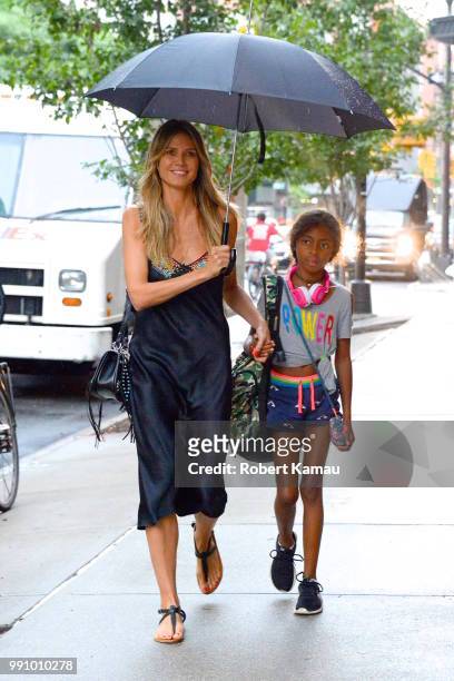 Heidi Klum and daughter Lou seen out on a rainy evening in Manhattan on July 3, 2018 in New York City.