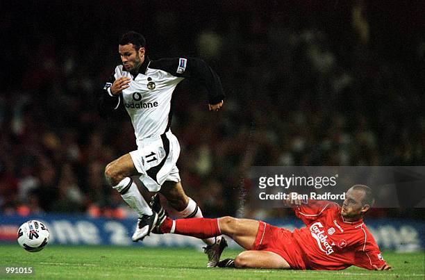 Danny Murphy of Liverpool tries to tackle Ryan Giggs of Manchester United during the One 2 One FA Charity Shield between Liverpool and Manchester...