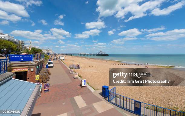 view of the beach, promenade and pier, eastbourne - eastbourne pier photos et images de collection