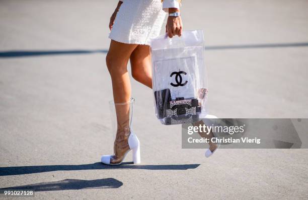 Erica Pelosini wearing sheer Chanel bag, sheer boots, flat cap is seen outside Chanel on day three during Paris Fashion Week Haute Couture FW18 on...