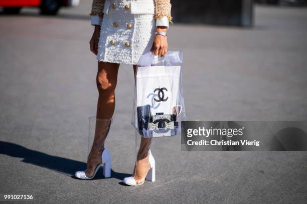 Erica Pelosini wearing sheer Chanel bag, sheer boots, flat cap is seen outside Chanel on day three during Paris Fashion Week Haute Couture FW18 on...